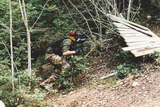 Side view of army solider training in forest