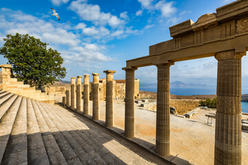 Fototapeta premium Ruins of Acropolis of Lindos view, Rhodes, Dodecanese Islands, Greek Islands, Greece. Acropolis of Lindos, ancient architecture of Rhodes, Greece.