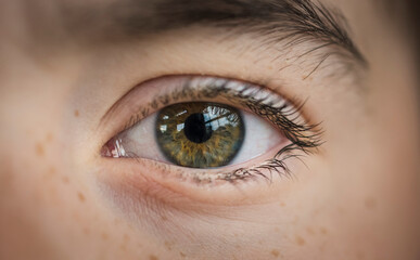 Extreme close-up portrait of boy with hazel eye