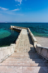 Kaiser Wilhelm's bridge and walkway a stone swim platform in Corfu, Greece - obrazy, fototapety, plakaty