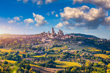 Town of San Gimignano, Tuscany, Italy with its famous medieval towers. Aerial view of the medieval village of San Gimignano, a Unesco World Heritage Site. Italy, Tuscany, Val d'Elsa. - obrazy, fototapety, plakaty