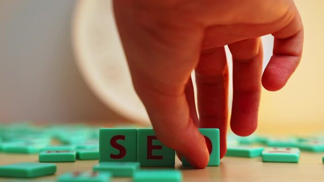 Internet Marketing and Web Analytics. Seo Search Engine Optimization. The word SEO made of small colorful game board pieces with letters imprinted on them. . High quality 4k footage