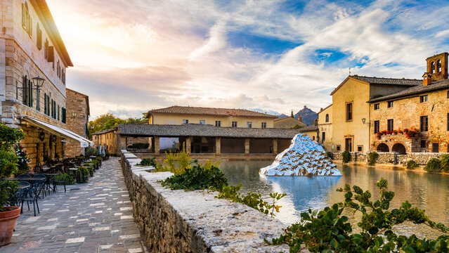Thermal bath town of Bagno Vignoni, Italy during sunrise. Old thermal baths in the medieval village Bagno Vignoni, Tuscany, Italy. Medieval thermal baths in village Bagno Vignoni, Tuscany, Italy
