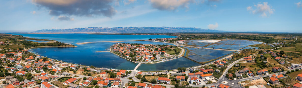 Historic town of Nin laguna aerial view with Velebit mountain background, Dalmatia region of Croatia. Aerial view of the famous Nin lagoon and medieval in Croatia