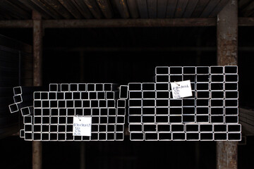Metal pipes arranged in factory