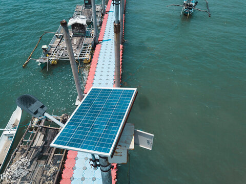 Aerial view of pier with  Solar panels during sunny day