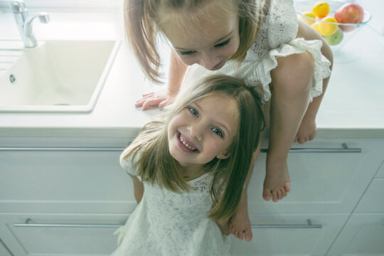 Beautiful children having fun in the kitchen