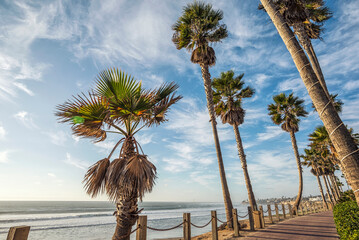 Mission Beach Boardwalk with coastal view.