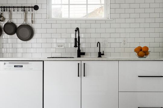 Kitchen Sink And White Subway Tile Backsplash