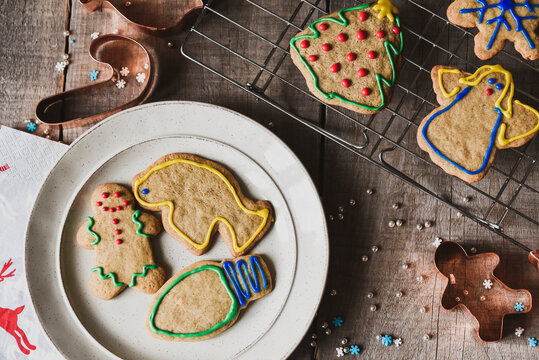 Christmas shaped cookies on plate and cooling rack shot from above