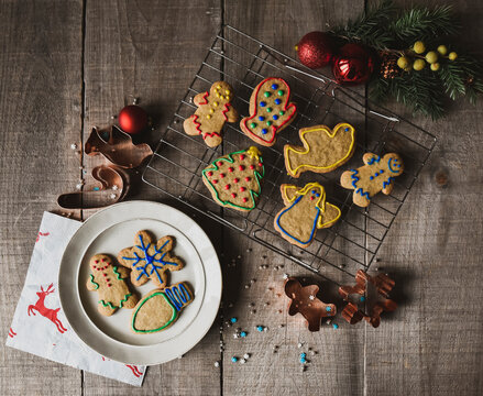 Christmas shaped cookies on plate and cooling rack shot from above