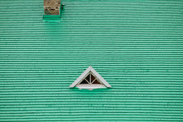 A green roof with a triangular window