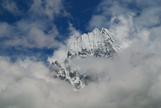 Mount Thamserku amid clouds Everest Region Nepal