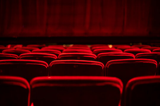 Red seats and curtains of an empty theater