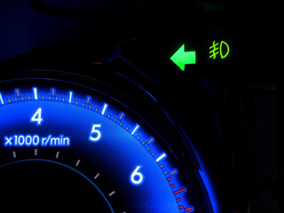 car turning signal lights on car dashboard.	