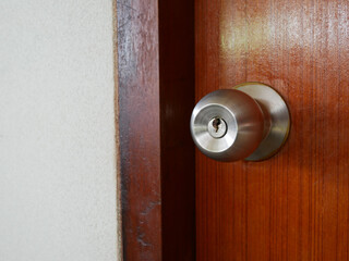 Fototapeta na wymiar closeup of door knob on wooden door.
