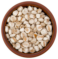Top view of ceramic bowl with white corn for cooking. Zenith. Aerial view. dish containing grains ready for the preparation of a food recipe.
