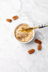 Overhead View of Pecan Butter in a White Bowl