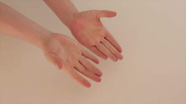 Hand catching a zuchini