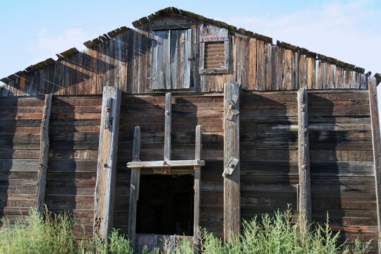 abandoned wooden barn on the prairie of Custer County Montana