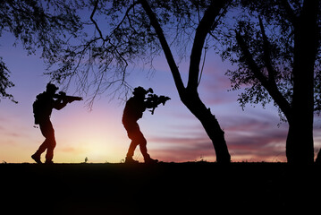 soldiers fighting while silhouette at sunset