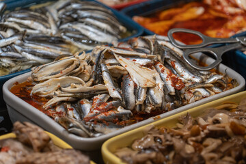 Close up view of spicy canned sardines at a French market