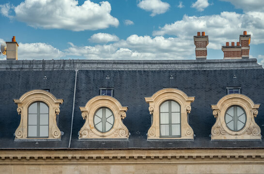 Mansard dormer windows on a classic Parisian house