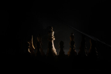 Chess pieces under a black veil without queen.