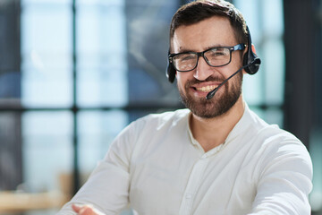 Hotline and helpdesk support operator working in office