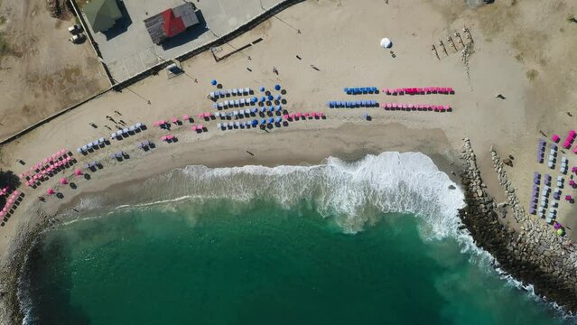 Aerial view picturesque public beach with turquoise water. Los Corales, La Guaira, Venezuela.