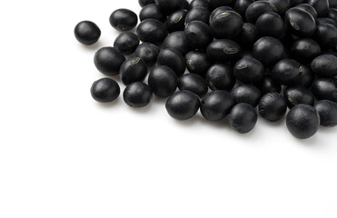 Black beans placed on a white background. Black soybeans (kurodazu).