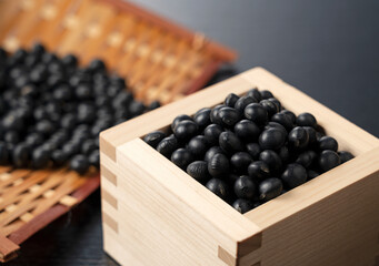 Black soybeans in a square on a black background.