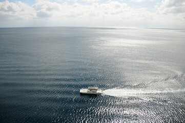 Boat in the ocean seen from above