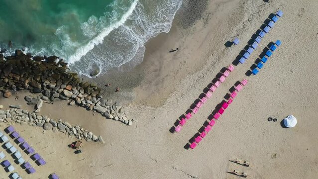 Aerial view picturesque public beach with turquoise water. Los Corales, La Guaira, Venezuela.