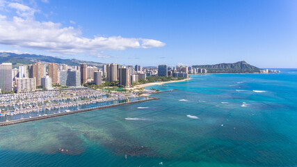 Aerial view of Ala Wai Boat Harbor with Waikiki Beach and Honolulu area of Oahu in the background in Hawaii