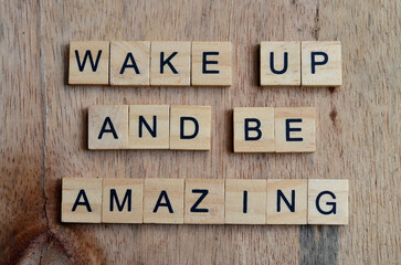 wake up and be amazing text on wooden square, motivation and inspiration quotes