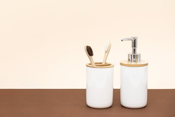 Soap dispenser and bamboo toothbrushes, zero waste bathroom concept. Eco friendly daily body care products.