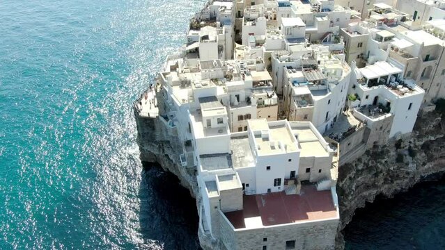 Drone capture the rotating shot of Polignano a Mare, its a town on Italy located on the Adriatic coast