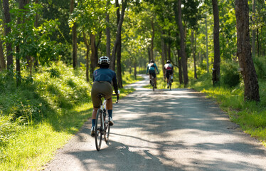 Fototapeta premium Asian woman riding a bicycle road bike