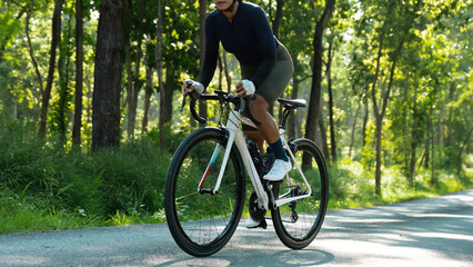 Asian woman riding a bicycle road bike