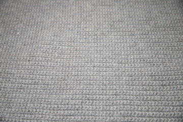 close up of gray knitted or crocheted tight knit blanket