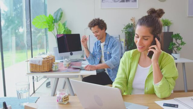 Couple Running Online Business Making Boutique Candles At Home Celebrating Order With Hug After Receiving Call On Mobile Phone - Shot In Slow Motion 