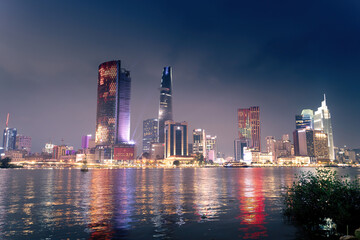 view of Bitexco and IFC One Tower, buildings, roads and Saigon river in Ho Chi Minh city - Laser...