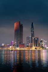 Obraz premium view of Bitexco and IFC One Tower, buildings, roads and Saigon river in Ho Chi Minh city - Laser and lighting show displayed. Travel and landscape concept.