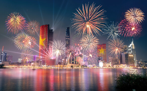 Celebration. Skyline With Fireworks Light Up Sky Over Business District In Ho Chi Minh City ( Saigon ), Vietnam. Beautiful Night View Cityscape. Holidays, Independence Day, New Year And Tet Holiday