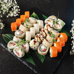 tasty sushi on the black background