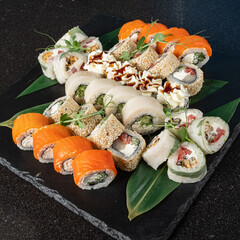 tasty sushi on the black background