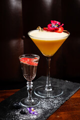 tasty cocktail with flower in bar