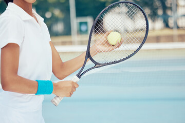 Tennis ball, racket and woman ready to serve during training on sports court for fitness, exercise...