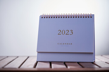 desk calendar 2023 on wooden table
